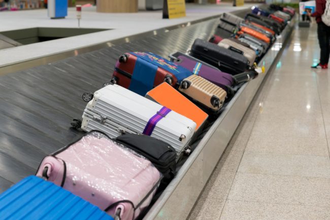 Suitcase Or Luggage With Conveyor Belt In The Airport