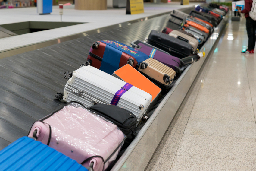 Suitcase Or Luggage With Conveyor Belt In The Airport