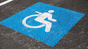 a wheelchair accessible parking spot's emblem painted on concrete